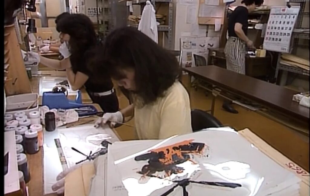 Cena icônica do filme Akira, revelando a estética cyberpunk e o movimento.