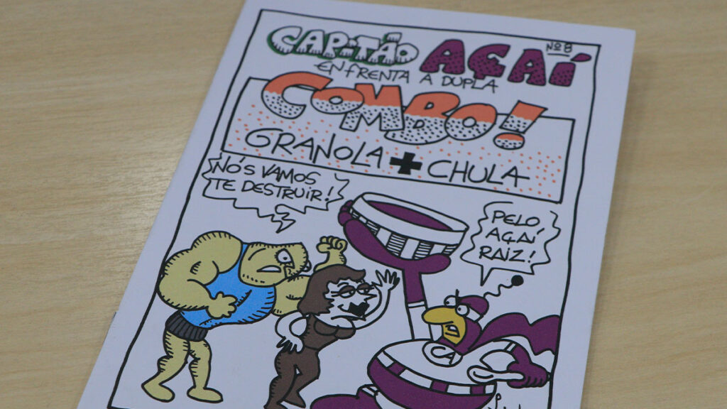 Capitão Açaí luta contra Granola e Chula em seu novo fanzine, preservando tradições culturais.